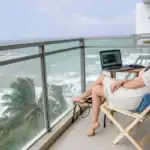 Digital nomads - working remotely from an ocean-view balcony in Sri Lanka