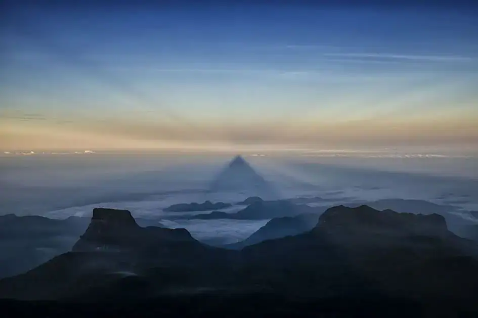 The Summit View of Adam's Peak with the Shadow of the Mountain with Sunrise