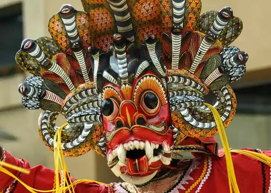 A Devil Dancer with a Naga (Cobra) Raksha Mask