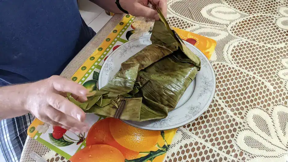 Opening the banana leaf wrapping