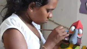 Sri Lankan artisan painting a traditional mask in Ambalangoda