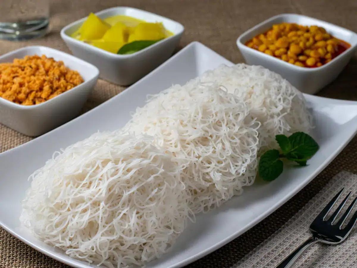 Sri Lankan string hoppers served with traditional side dishes